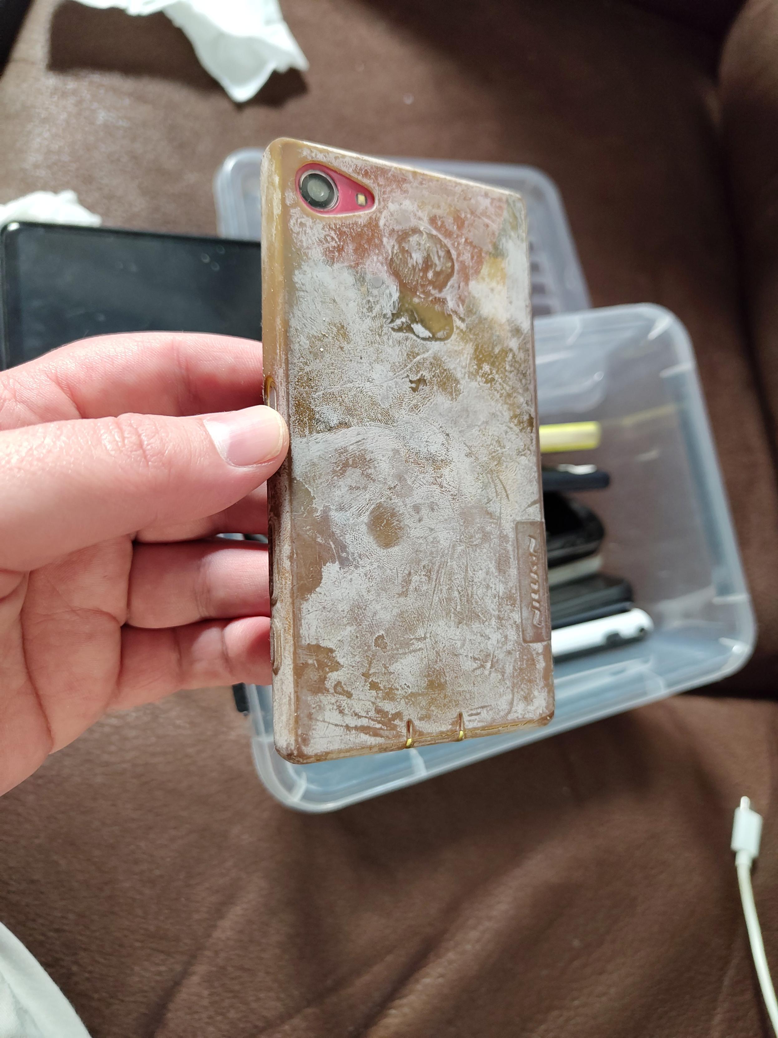 a photo of an older xperia phone in a white chalky looking tpu case that was once transparent