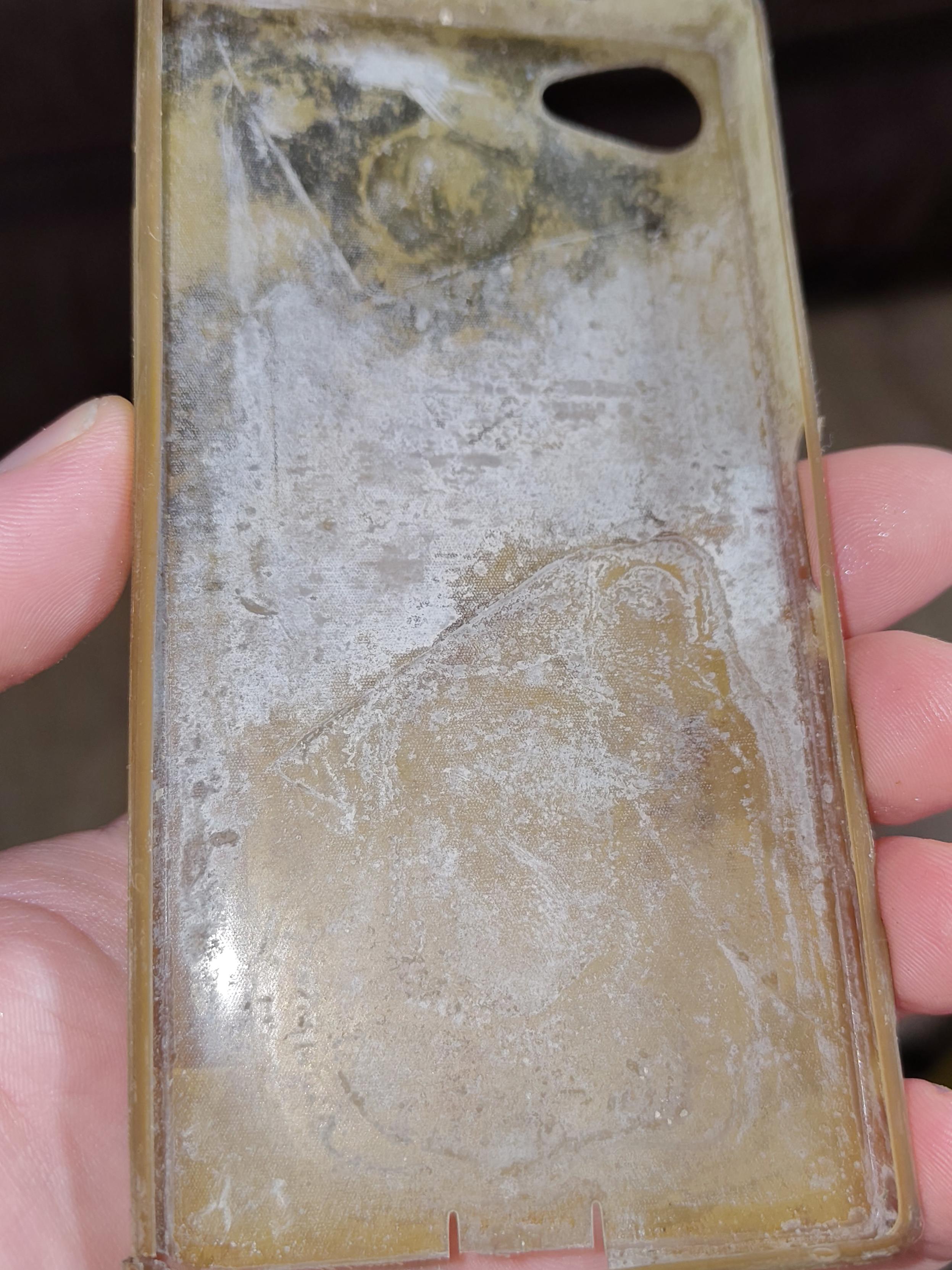 inside of the phone case, which is thoroughly chalky grey-white too, covering pretty much the entire thing